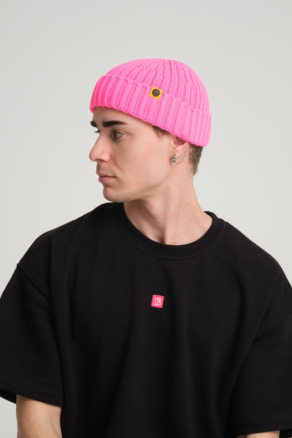 side view of a man wearing Fuchsia Fisherman Beanie