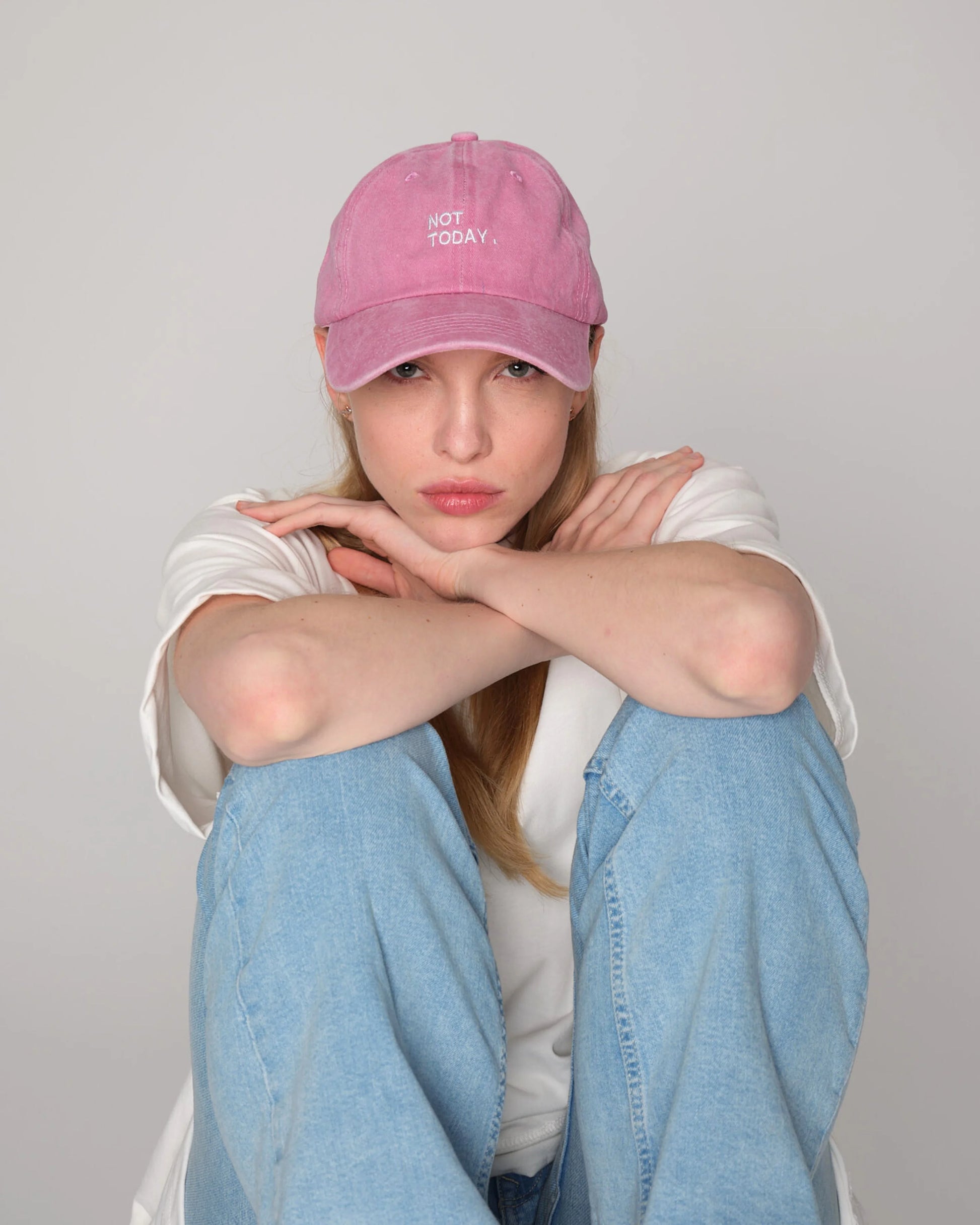 woman wearing Pink Washed Cap with Not Today embroidered in white
