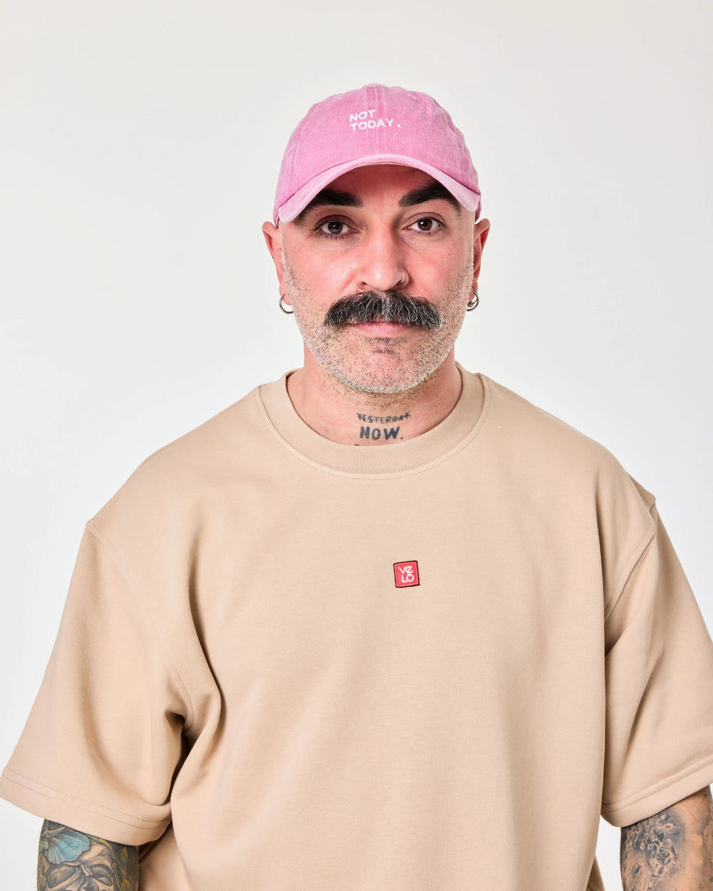 man wearing Pink Washed Cap with Not Today embroidered in white