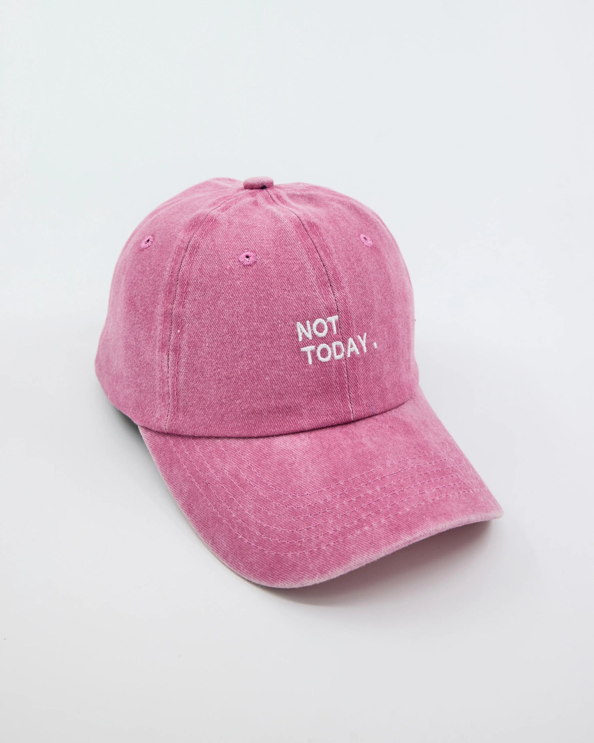 side view of Pink Washed Cap with Not Today embroidered in white