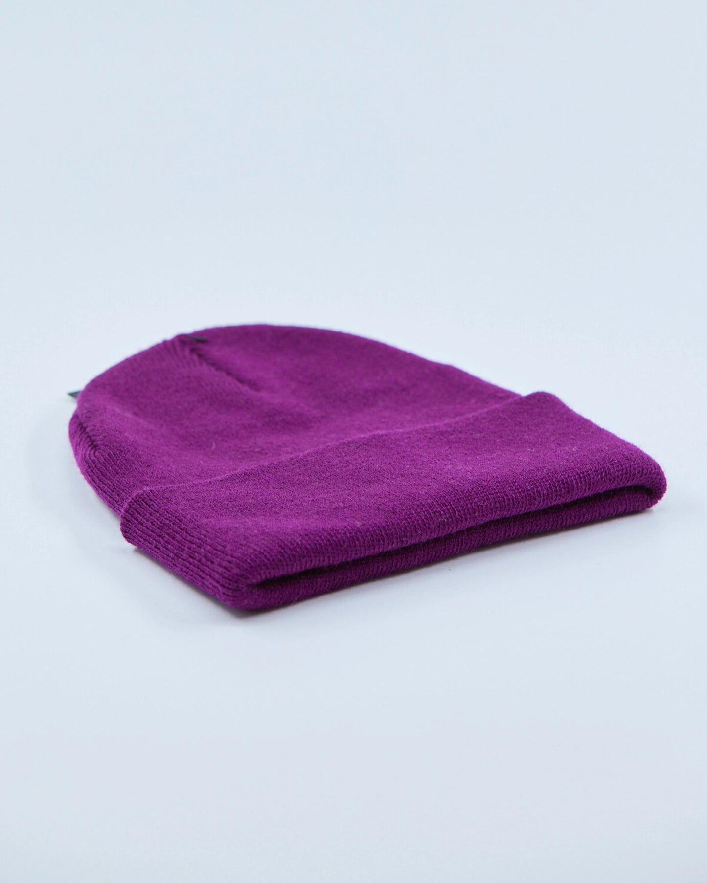 Purple beanie on a light gray background
