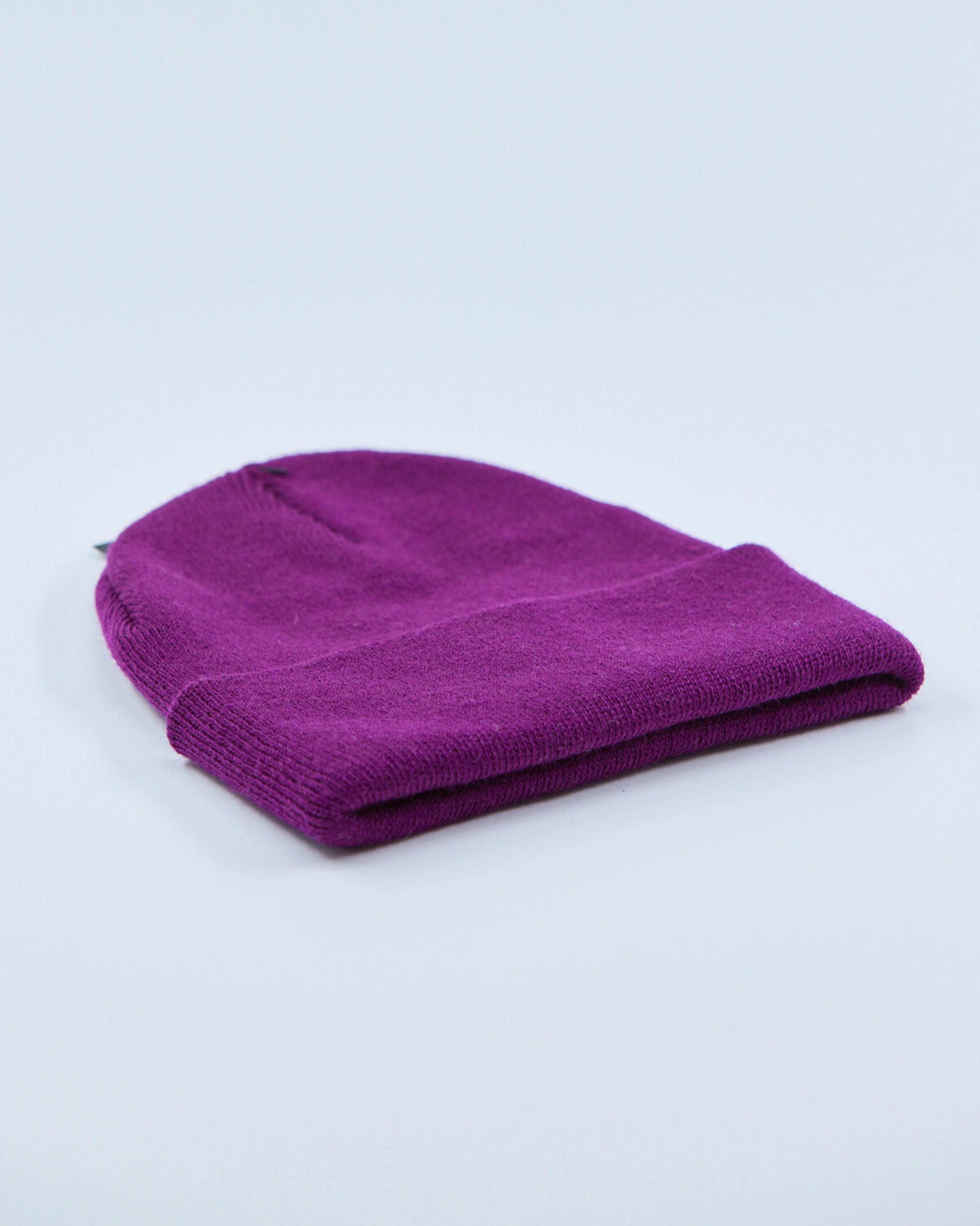 Purple beanie on a light gray background