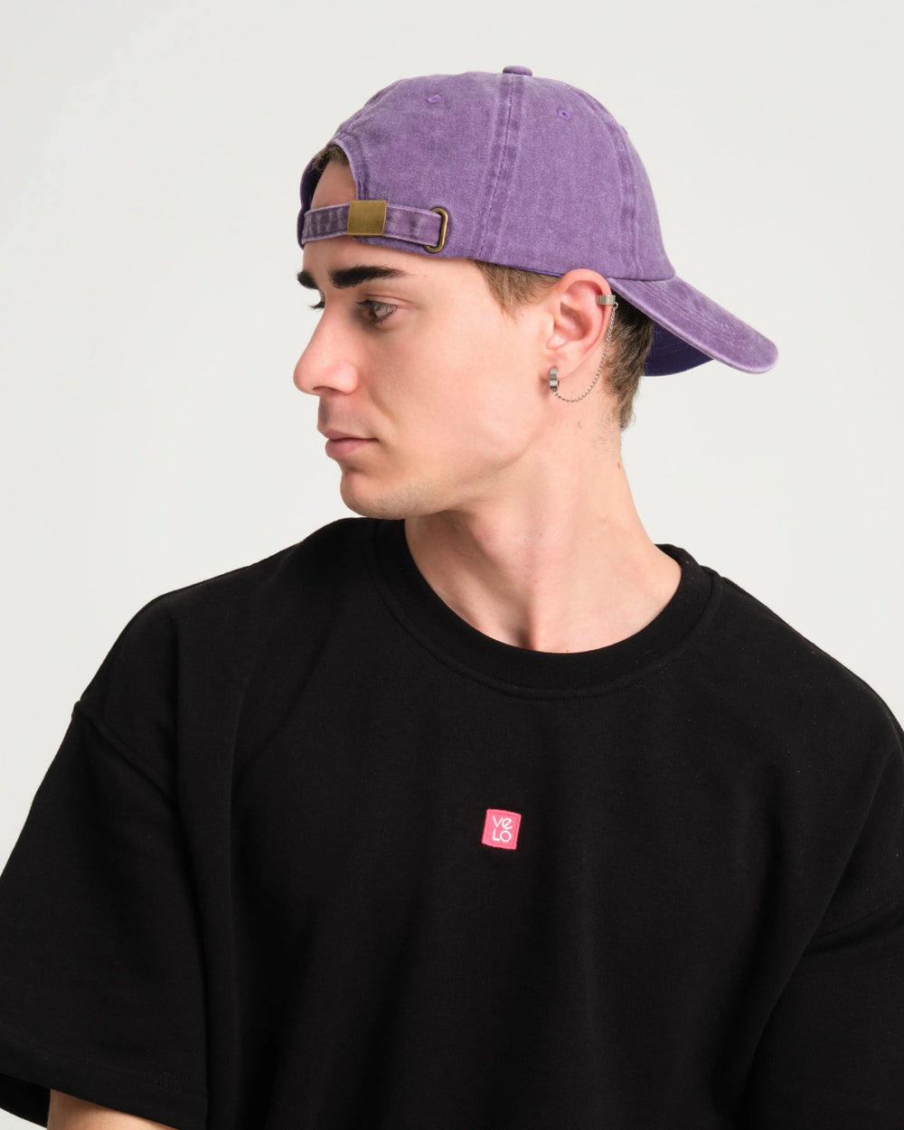 side view of a man wearing Cute But Psycho Purple Washed Cap