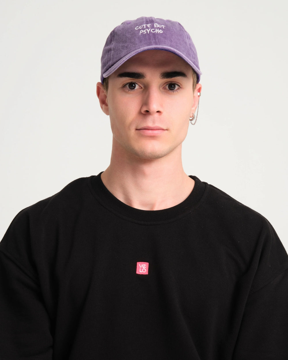 front view of a man wearing Cute But Psycho Purple Washed Cap Hat