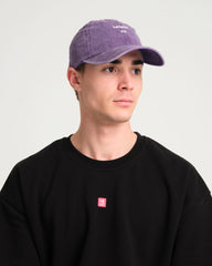 front view of a man wearing Hahaha No Purple Washed Cap