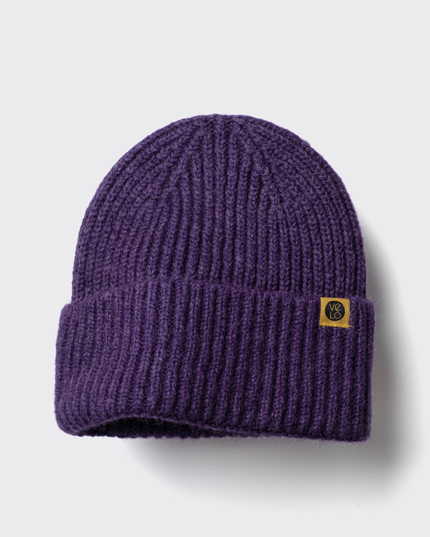 Purple Lux Beanie on a light gray background