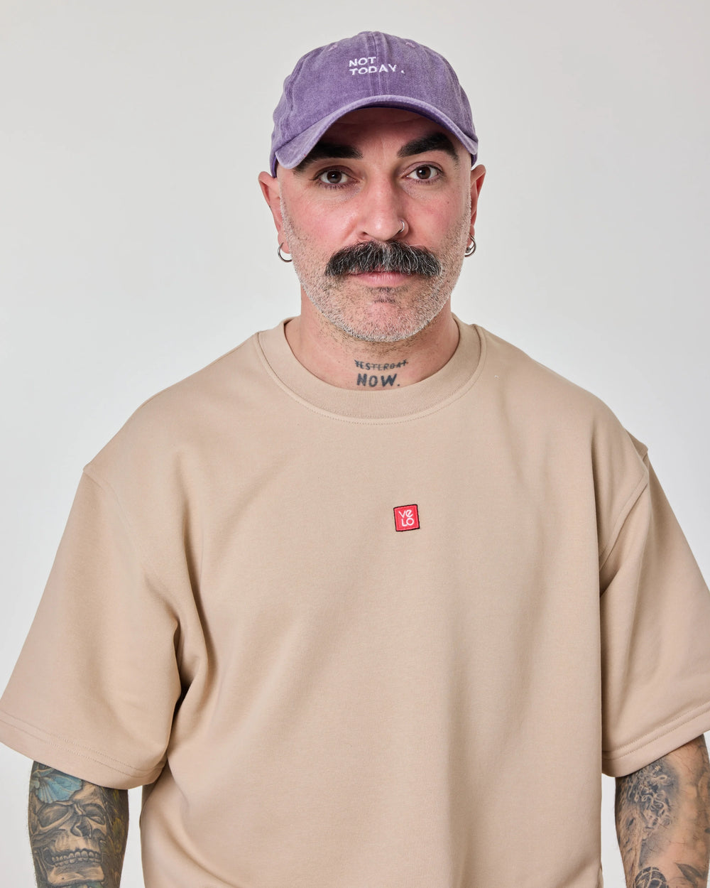 man wearing Purple Washed Cap with Not Today embroidered in white