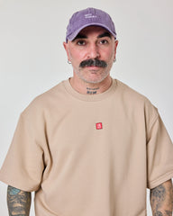 man wearing Purple Washed Cap with Not Today embroidered in white