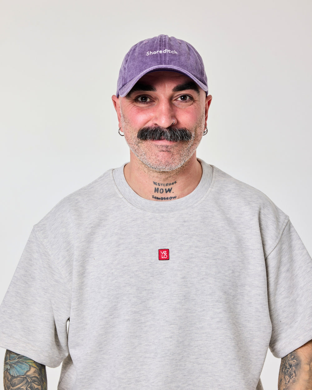 front view of a man wearing Shoreditch Purple Washed Cap