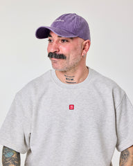 side view of a man wearing Shoreditch Purple Washed Cap
