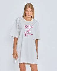 White oversized t-shirt with 'Real is Rare' text on a plain background