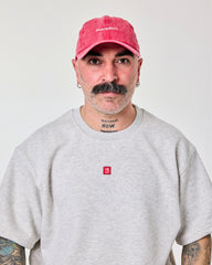 front view of a man wearing Shoreditch Red Washed Cap