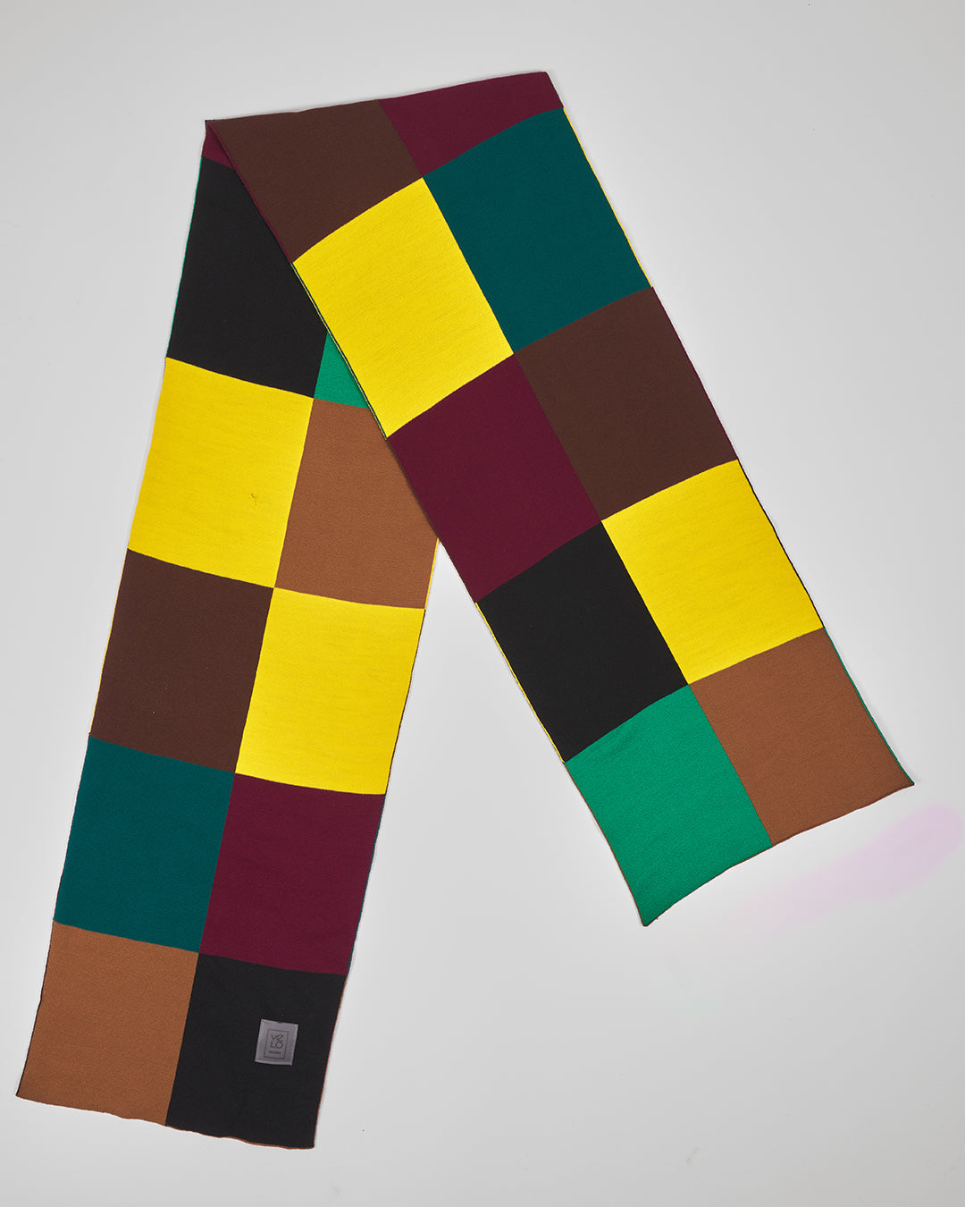 Roulette unisex acrylic scarf flat lay in yellow, forest green, burgundy, black and warm brown