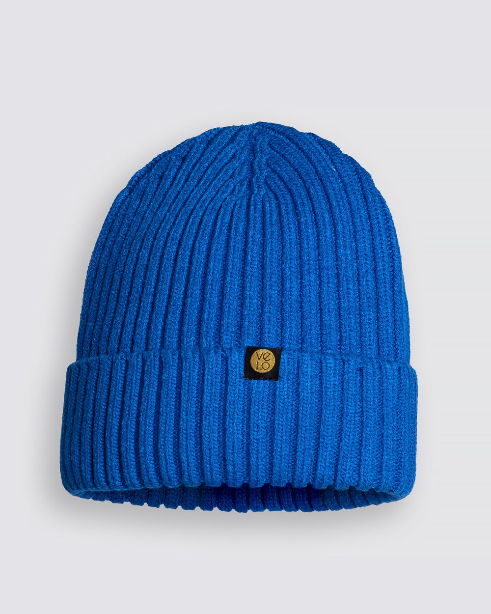 Royal blue beanie with a brand logo on a light gray background