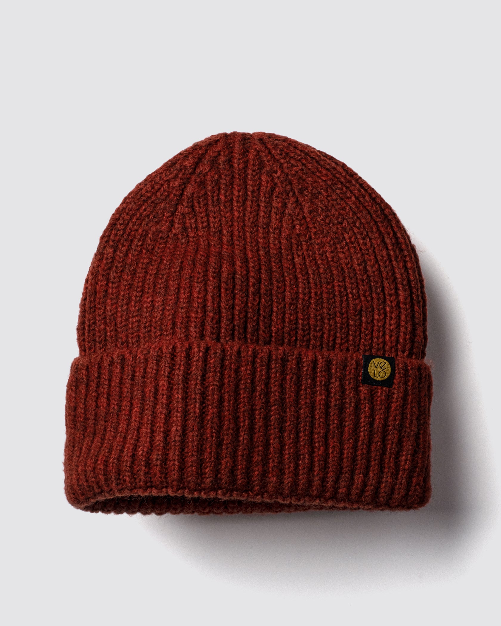 Rust Brown Lux Beanie on a light gray background