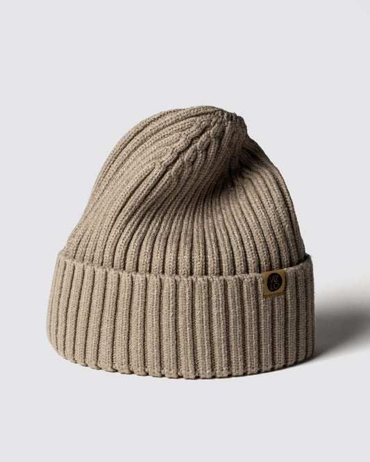 Sand Beige Classic Beanie with a brand logo on a light gray background