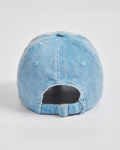 Blue distressed baseball cap on a light gray background