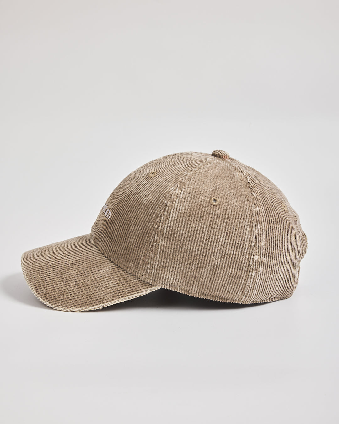 Beige corduroy cap on a light gray background