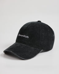 Black cap with brand logo on a white background