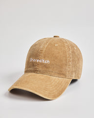 Camel cap with 'Snoreeditch' text on a light gray background