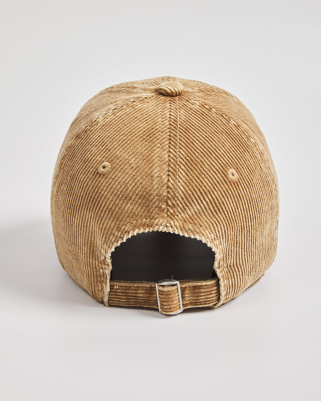 Camel corduroy cap on a light gray background