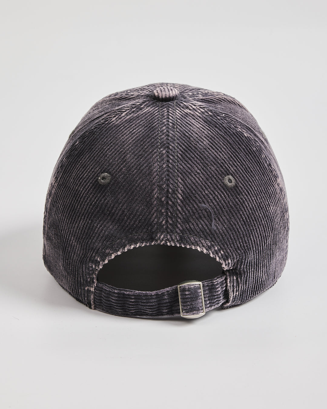 Gray distressed baseball cap on a light gray background