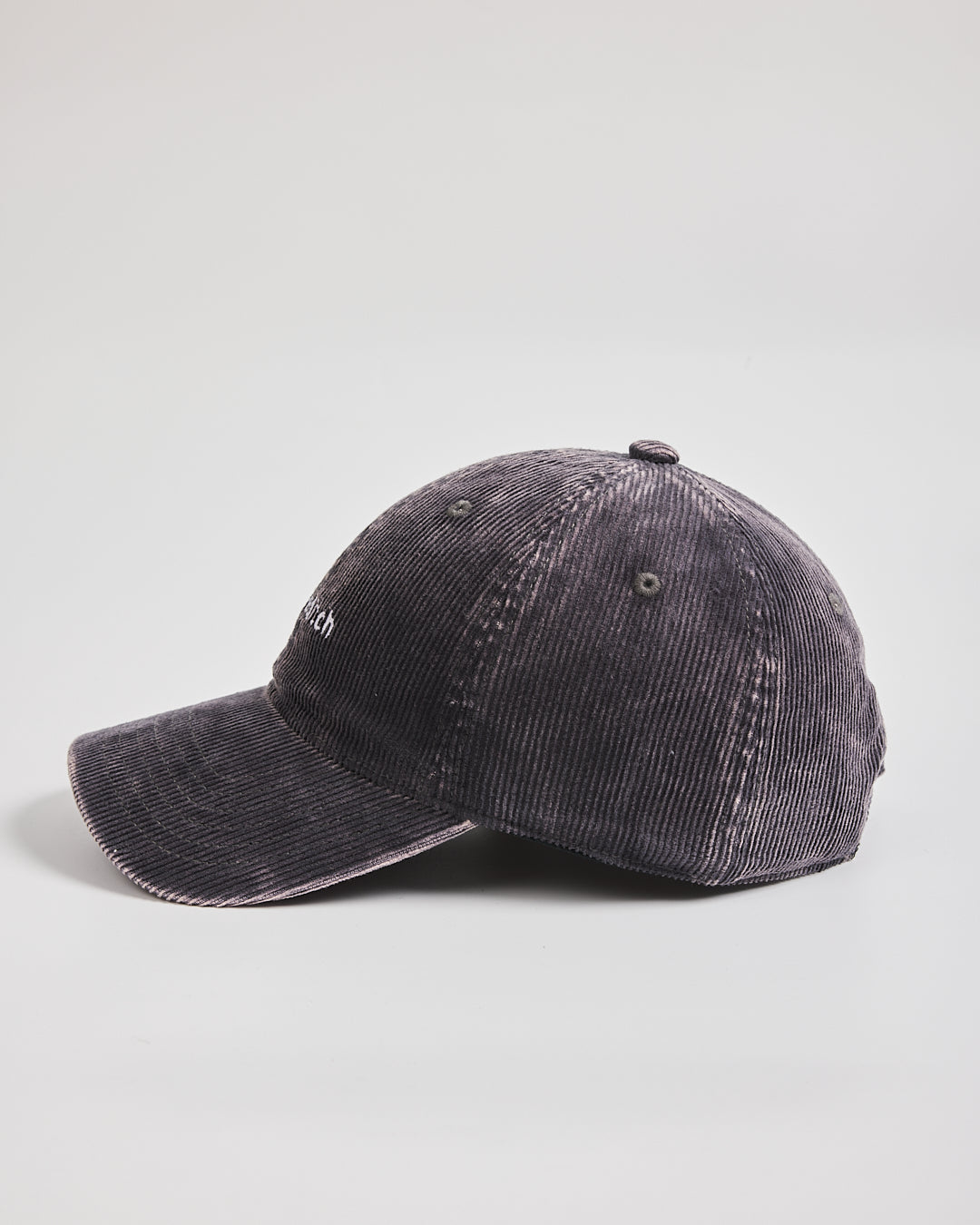 Grey distressed baseball cap on a light gray background