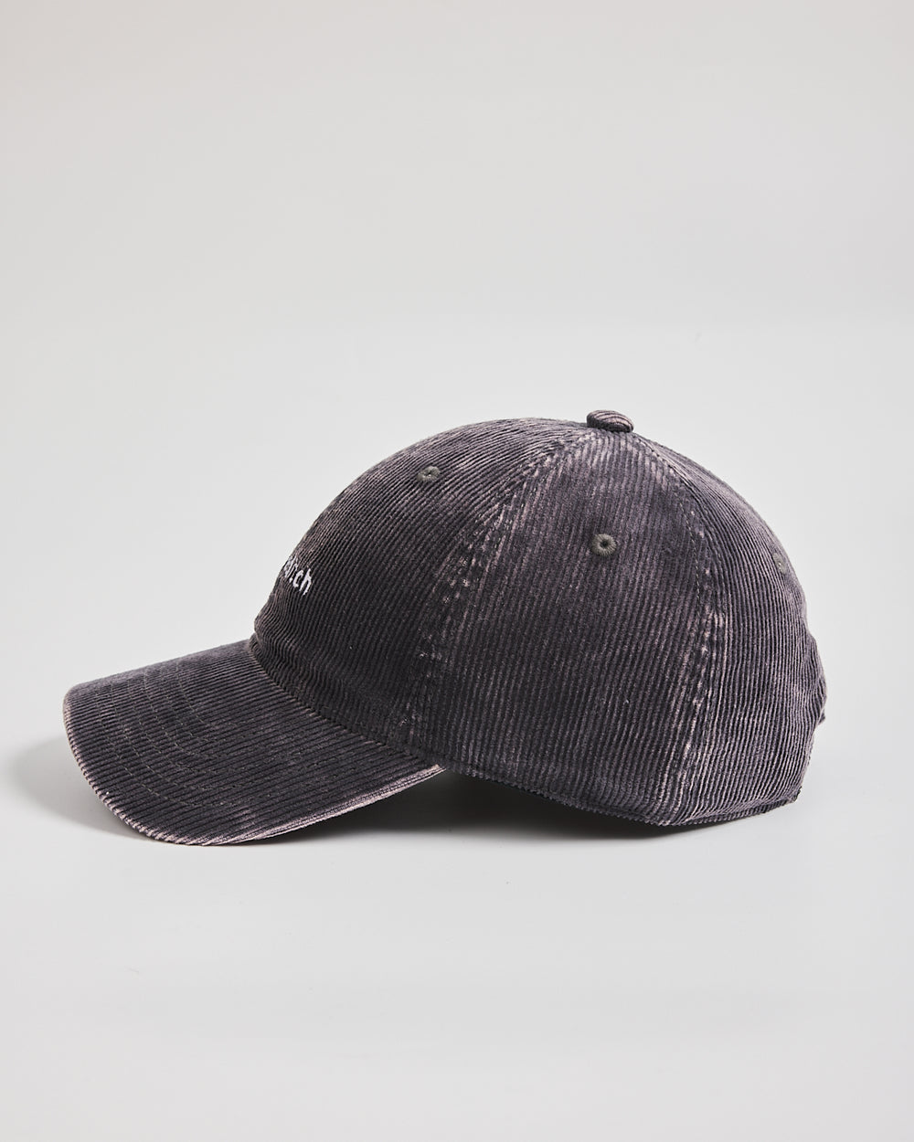 Grey distressed baseball cap on a light gray background