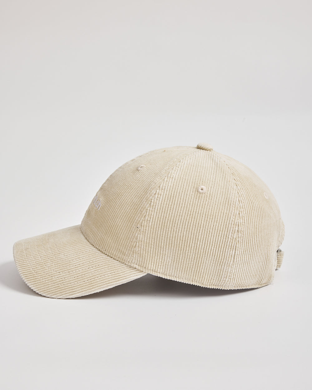 Cream corduroy cap on a light gray background