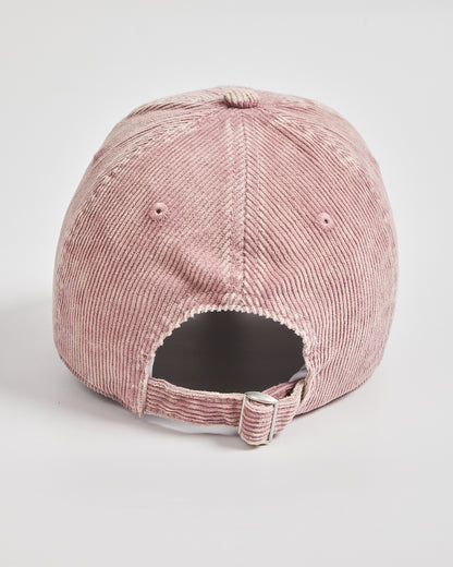 Pink corduroy cap on a light gray background