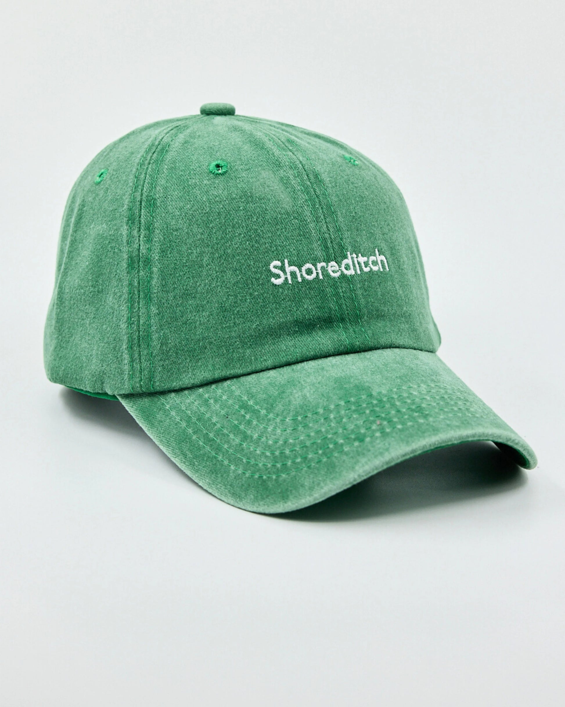 washed green shoreditch cap from the  left side angle