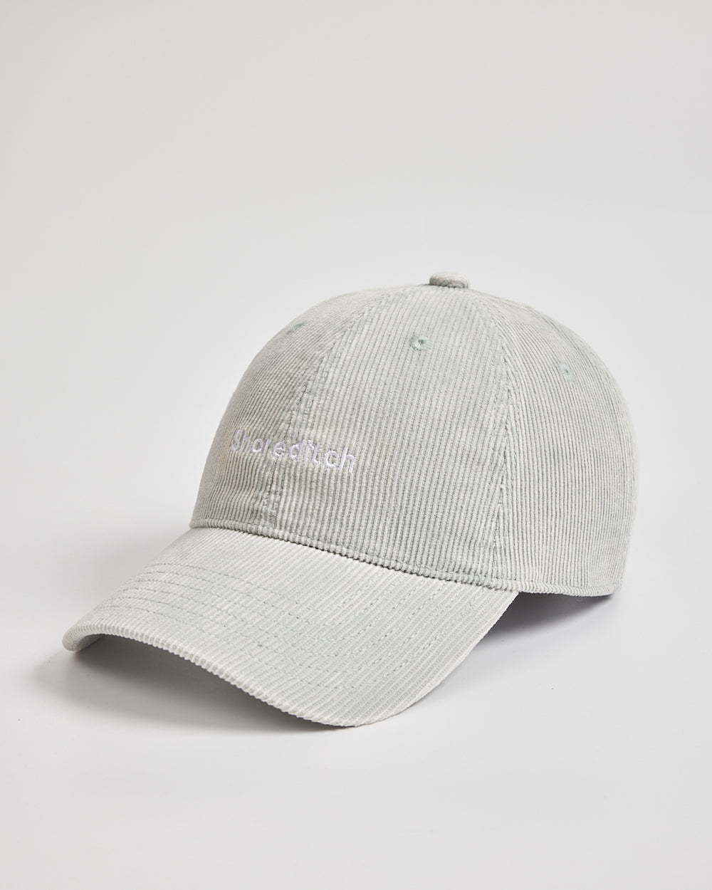 Gray cap with a brand logo on a light gray background