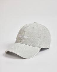 Gray cap with a brand logo on a light gray background