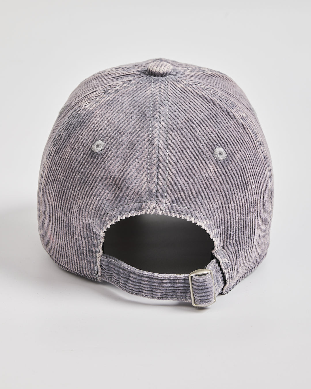 Back view of a gray corduroy cap on a light gray background