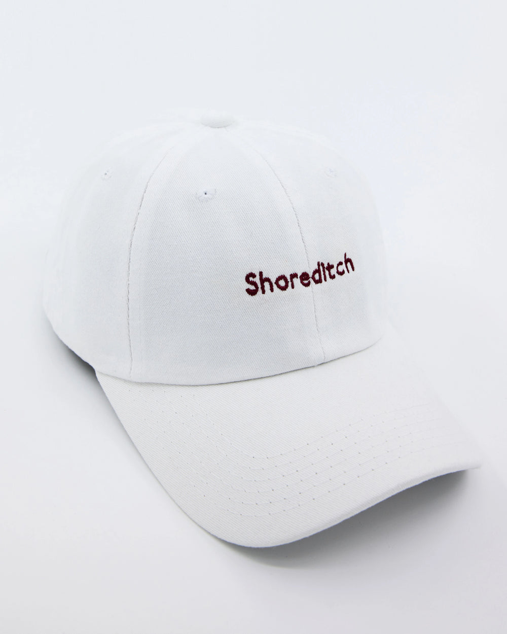 side look of shoreditch embroidered white cap