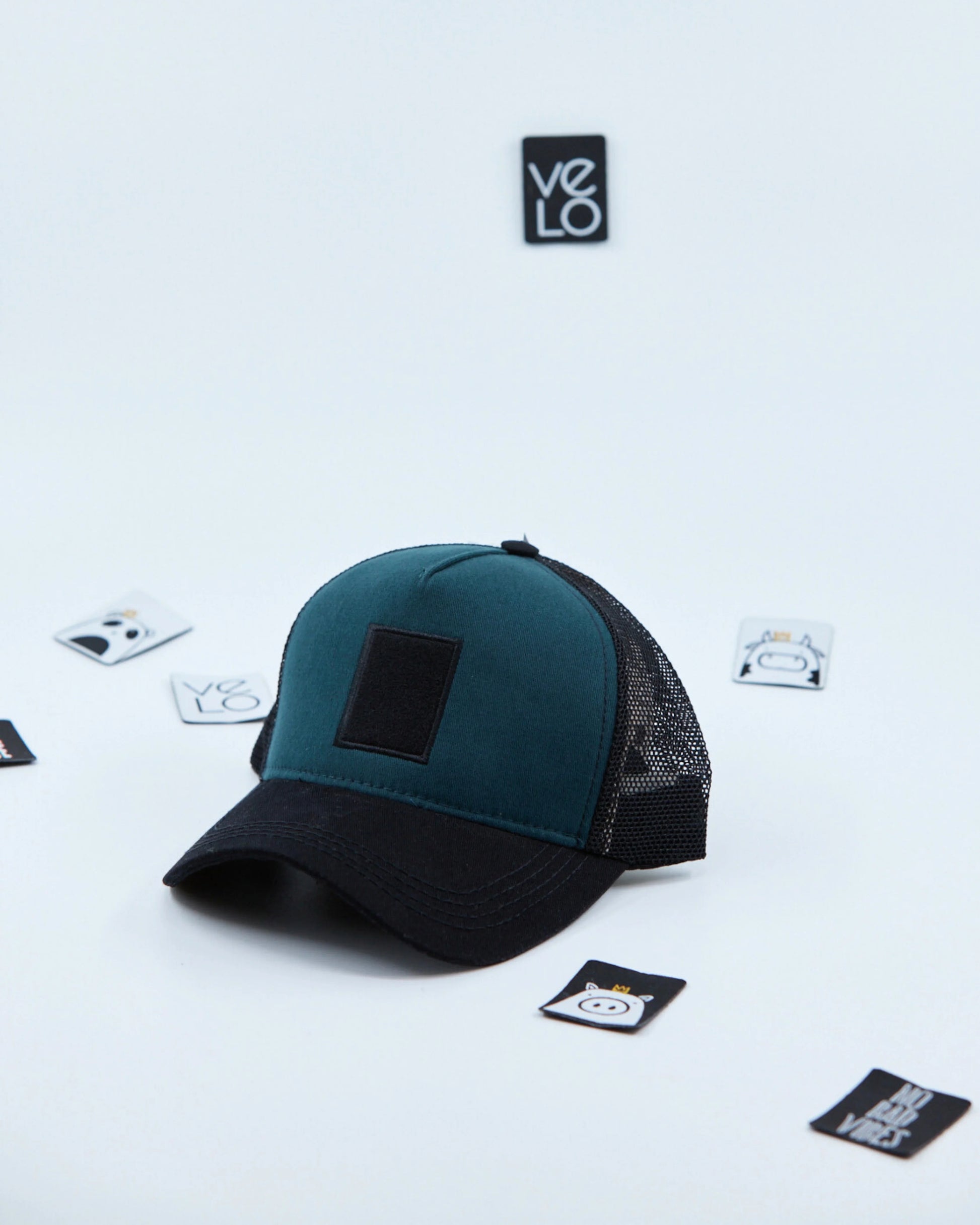 Side view of Teal Green and Black Customisable Trucker Cap
