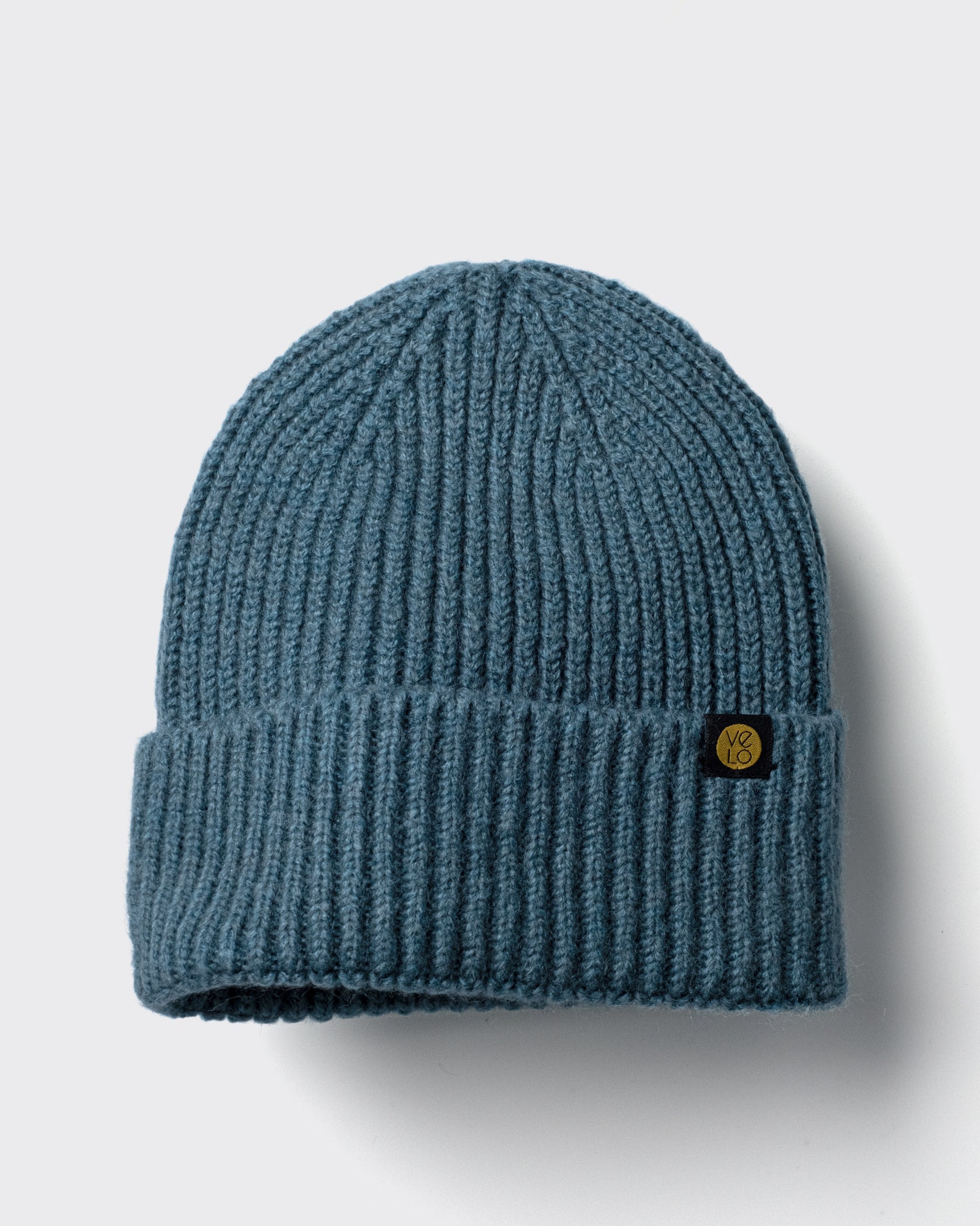 Teal Lux Beanie on a light gray background