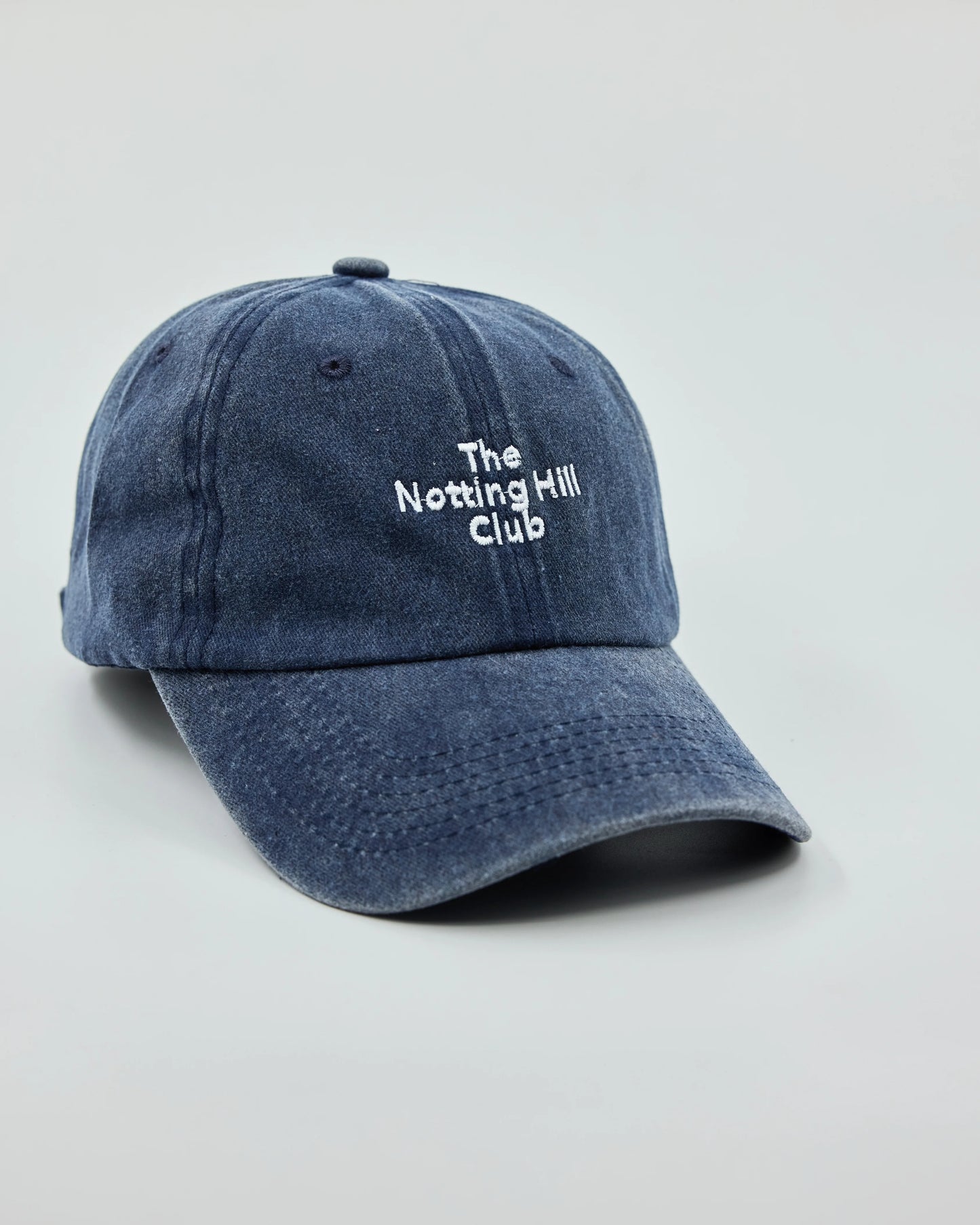 Side view of The Notting Hill Club Navy Washed Cap