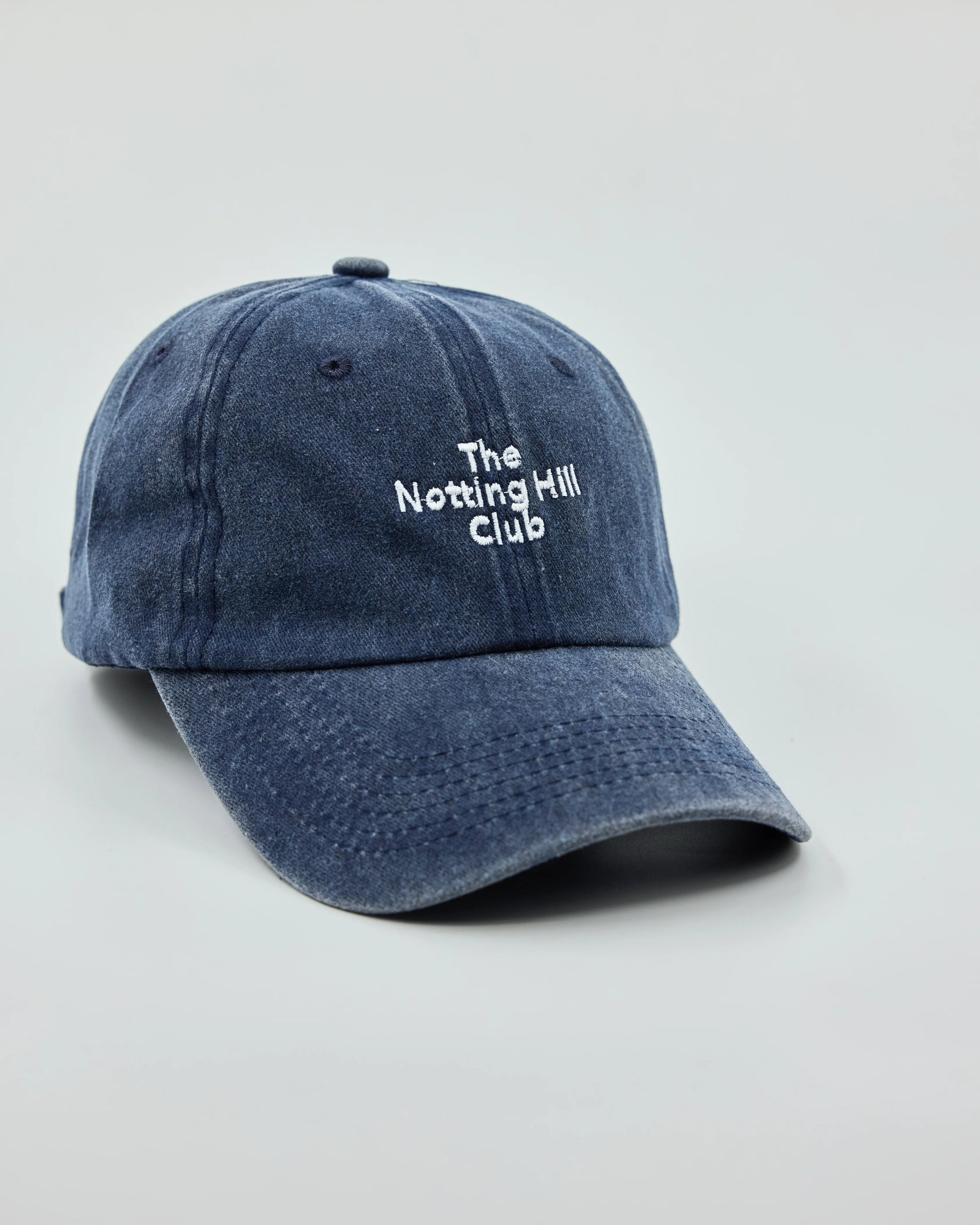 Side view of The Notting Hill Club Navy Washed Cap