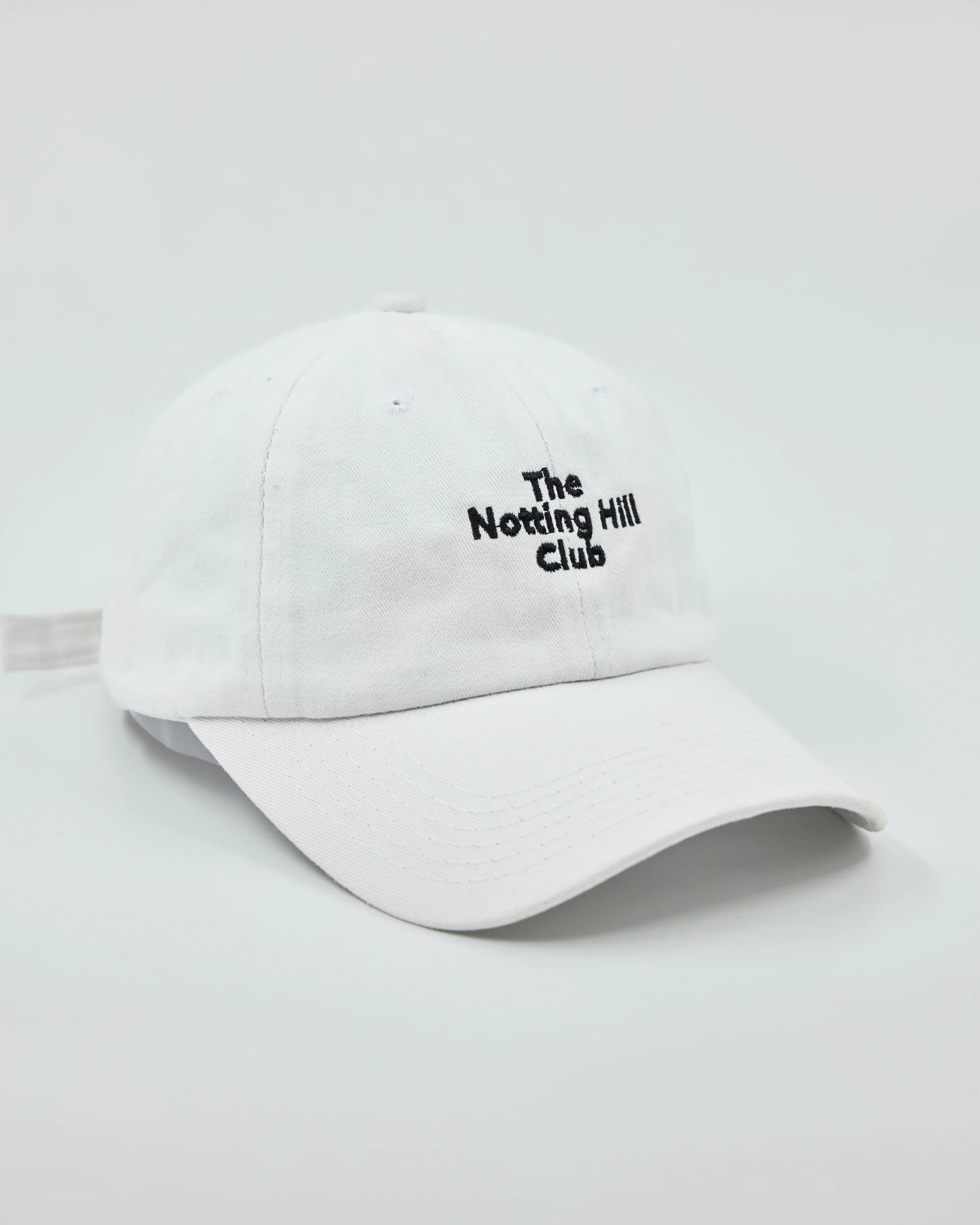 Side view of The Notting Hill Club White Washed Cap