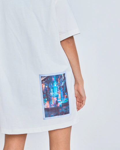 White t-shirt with a colorful print on a white background