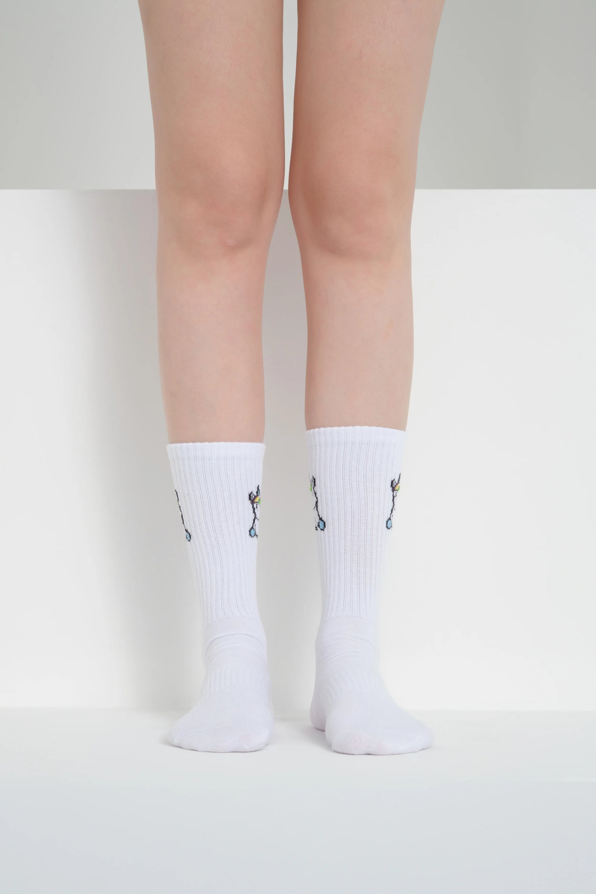 front view of white unicorn socks