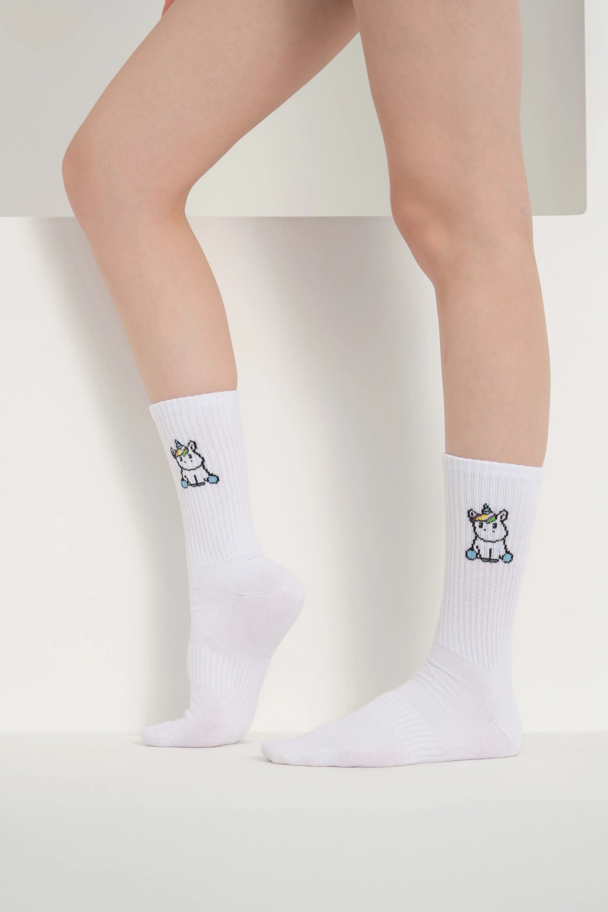 side view of white unicorn socks