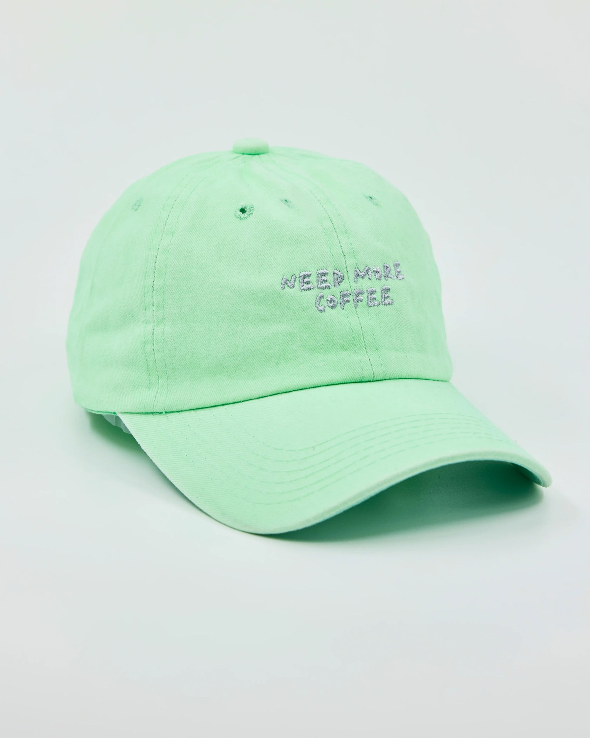 Side view of Need More Coffee Light Green Washed Cap