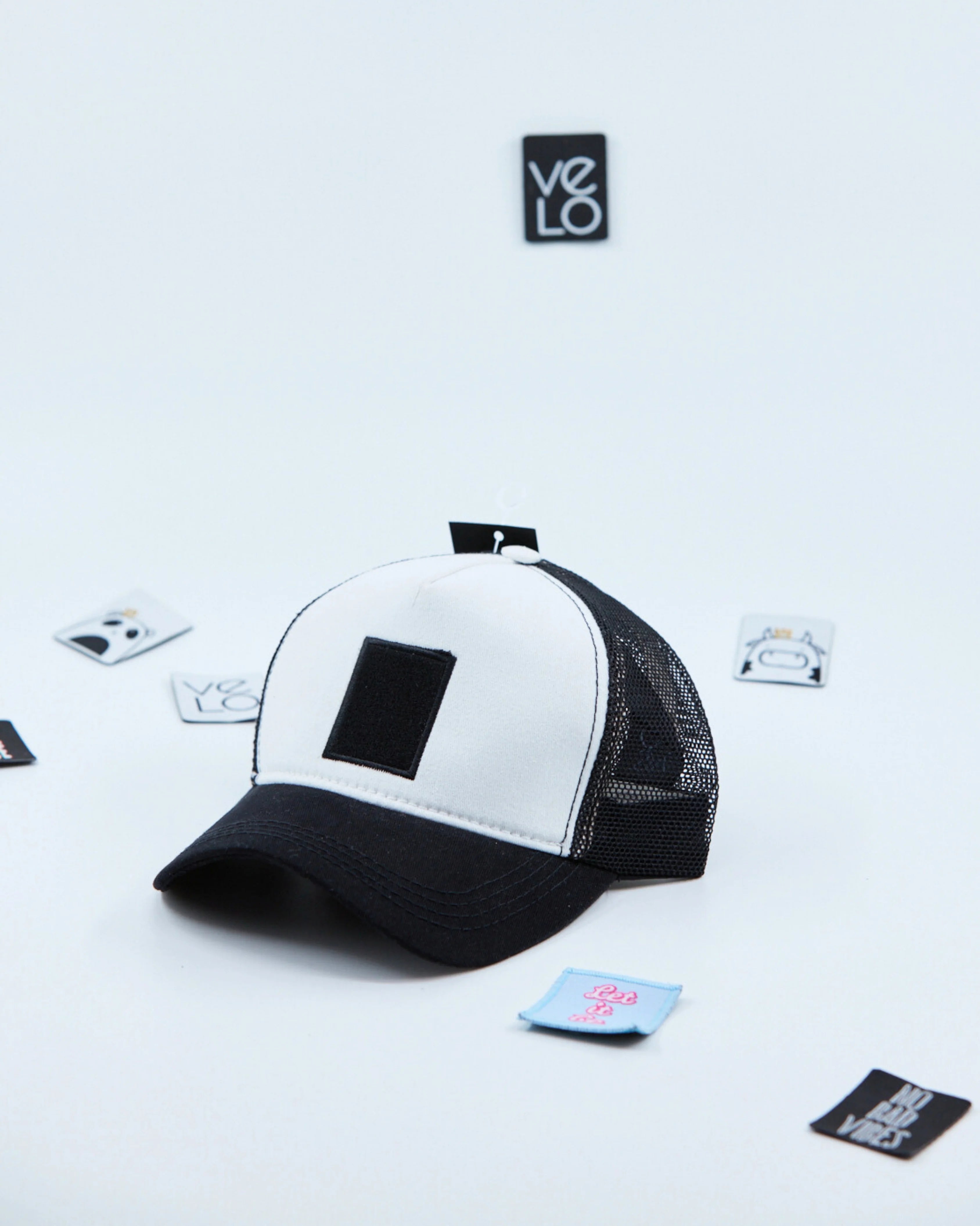 Side view of White and Black Customisable Trucker Cap