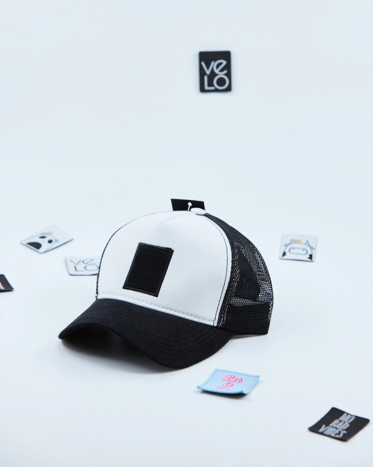 Side view of White and Black Customisable Trucker Cap