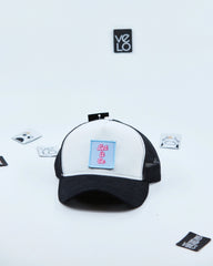 Side view of White and Black Customisable Trucker Cap with patches
