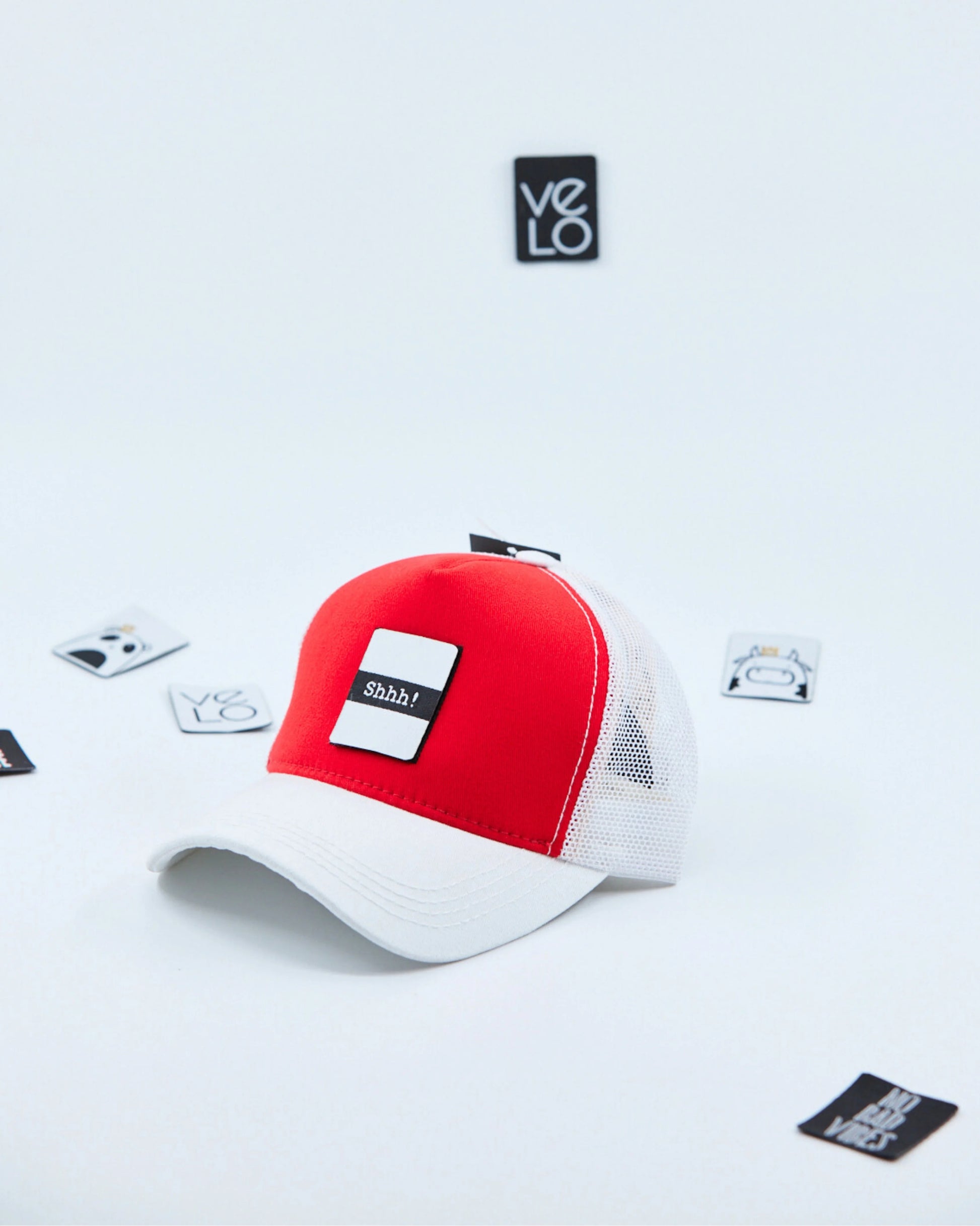 Side view of Red and White Customisable Trucker Cap with patches