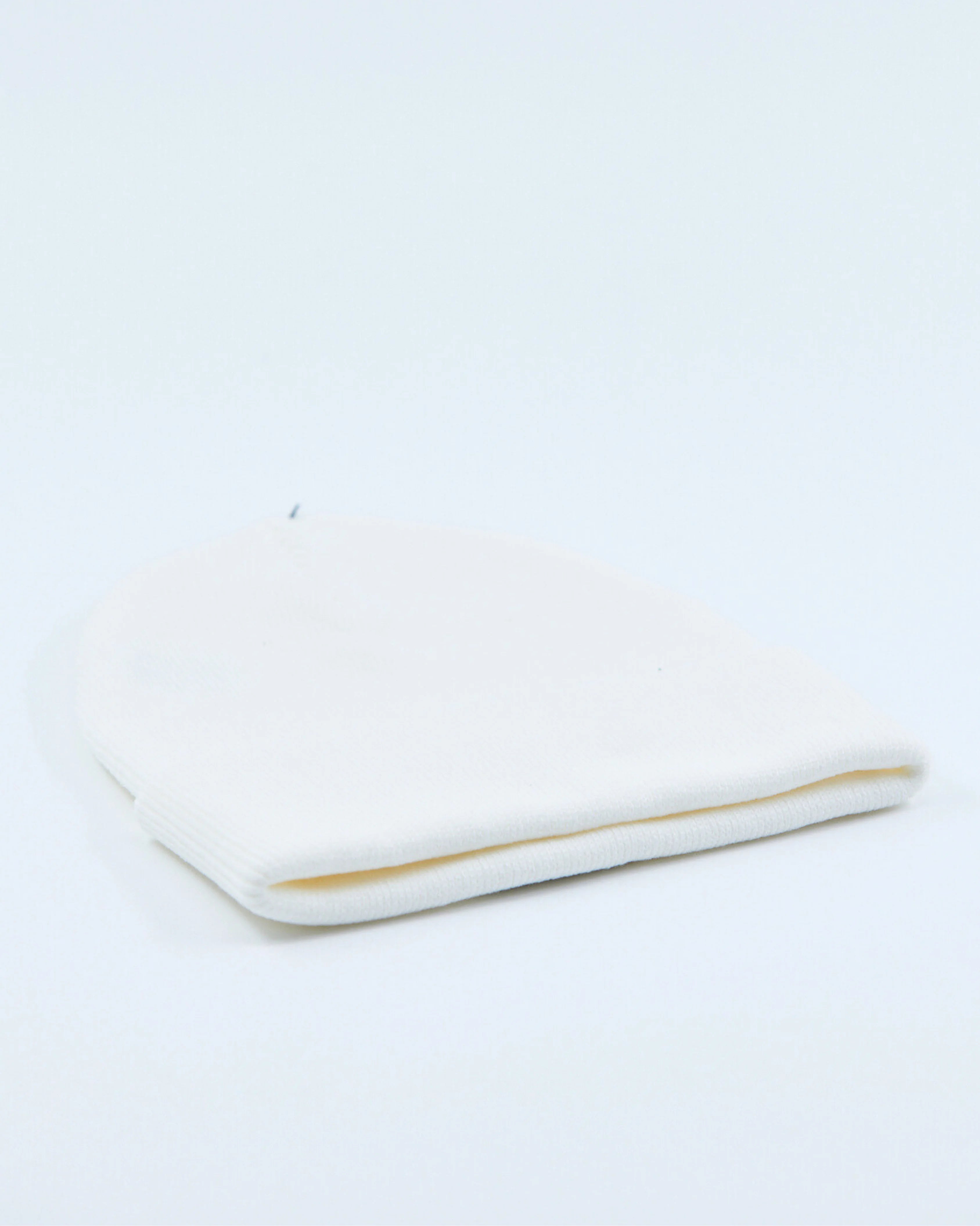 White beanie on a light gray background