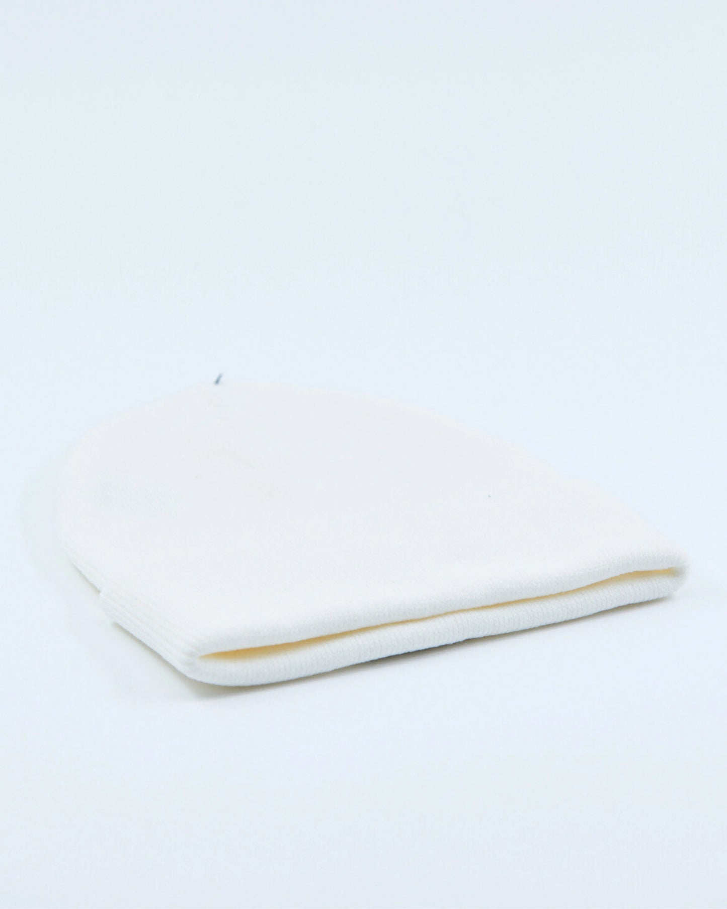 White beanie on a light gray background